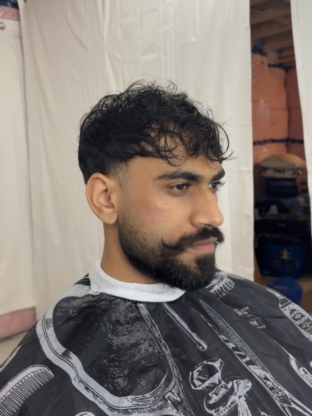 Clean fade and beard line-up after the appointment