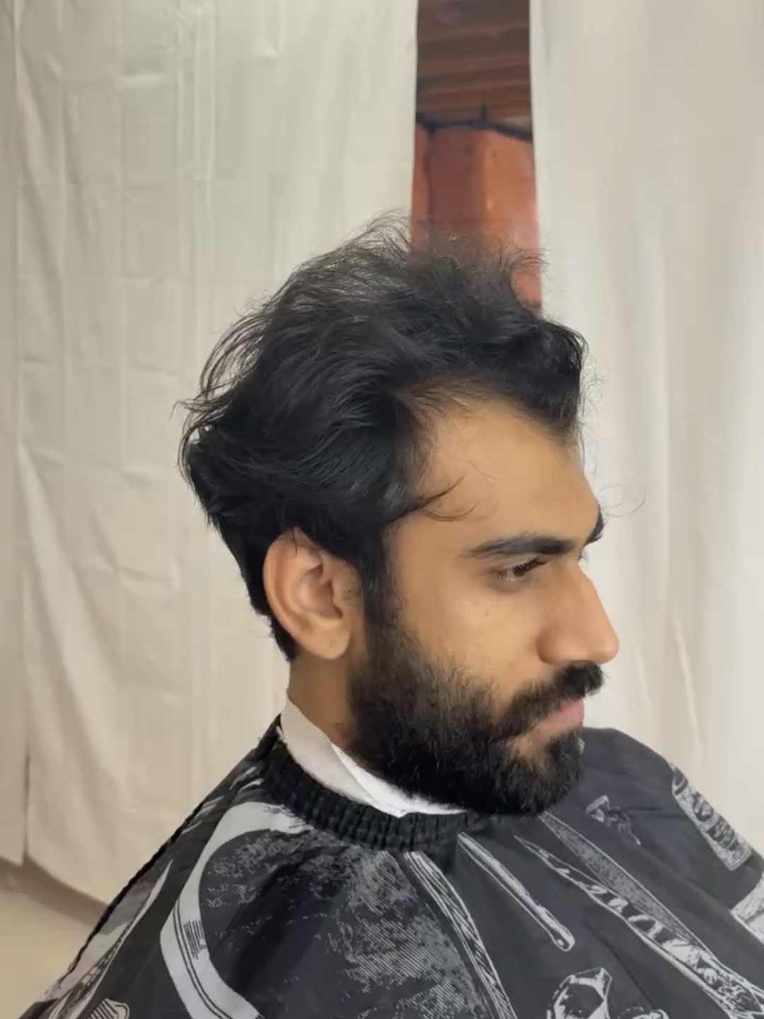 Grown-out hair and beard before the appointment