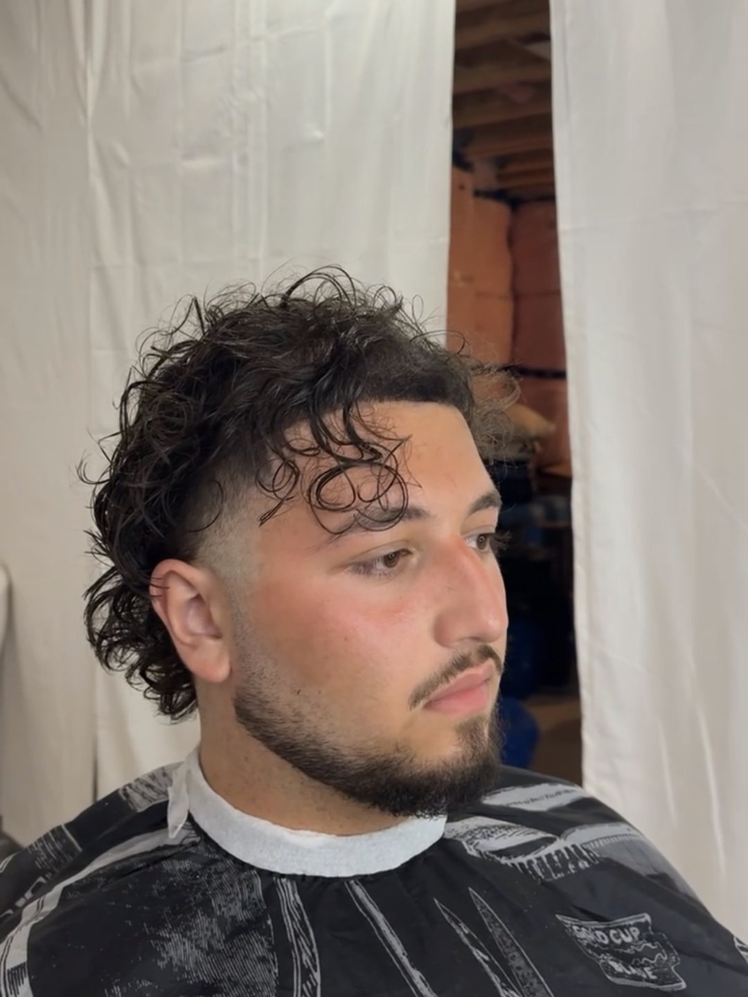 Defined curls with faded sides after the appointment