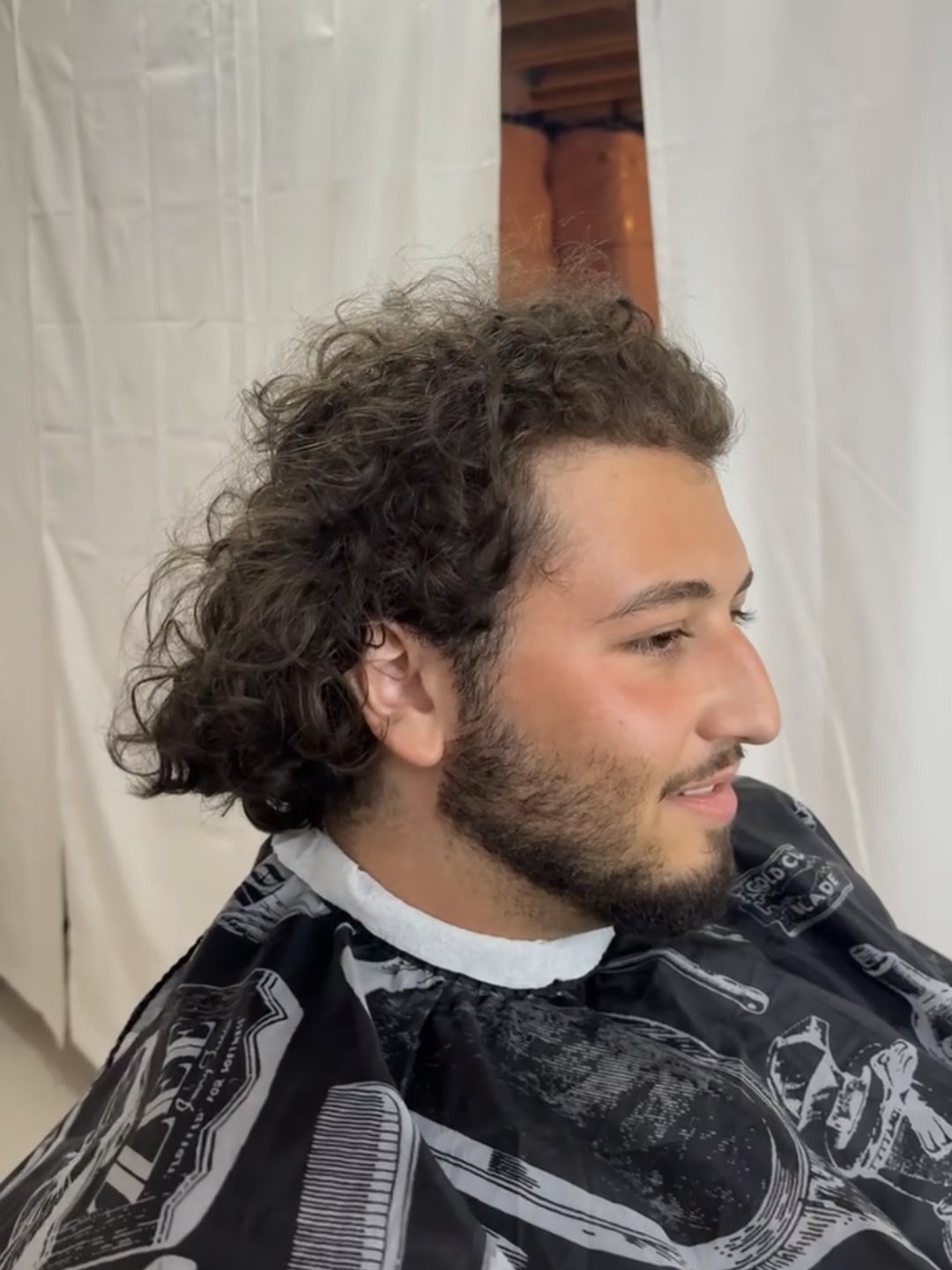 Grown-out curly hair before the appointment